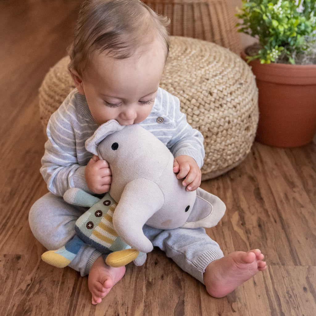 Baby playing with toy in Milan Raglan Button Knit Baby Pullover Sweater
