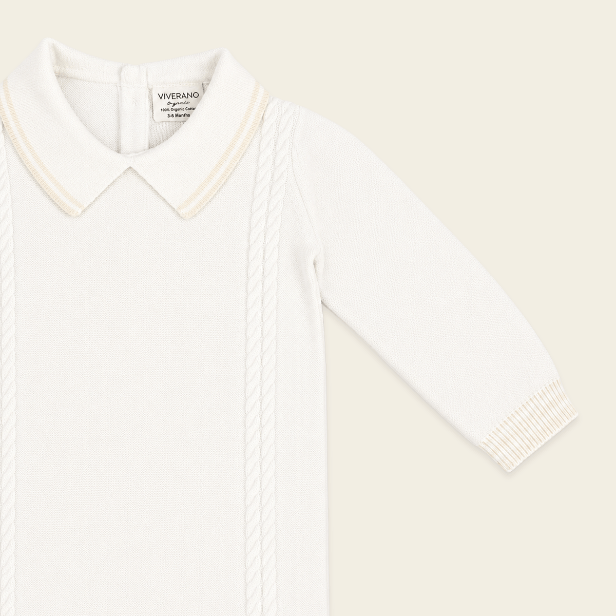 close up front view of milan dove white cable knit baby jumpsuit made of organic cotton