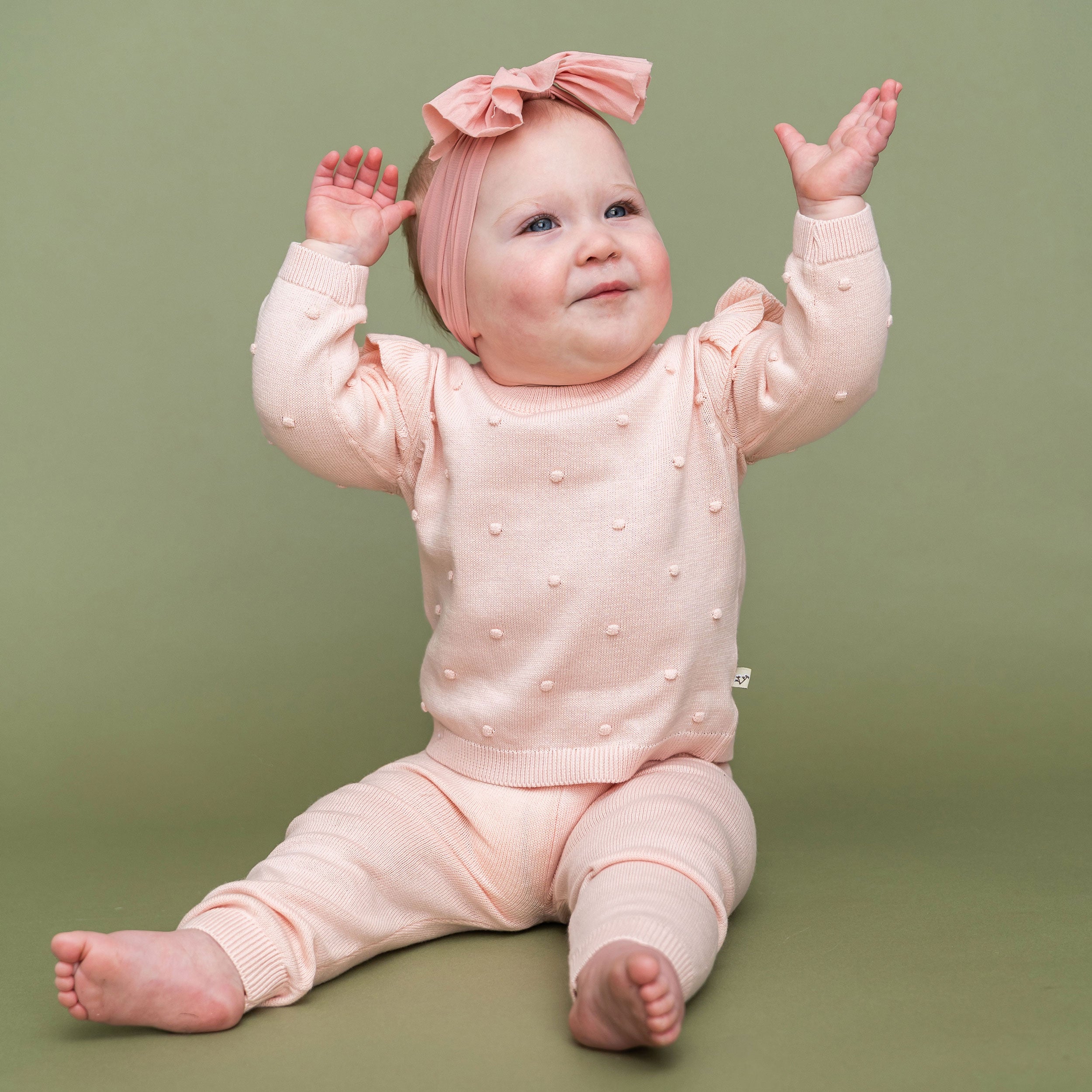 Milan Knit Baby Ruffle & Bobble Pullover Sweater Model Pose (Organic Cotton)