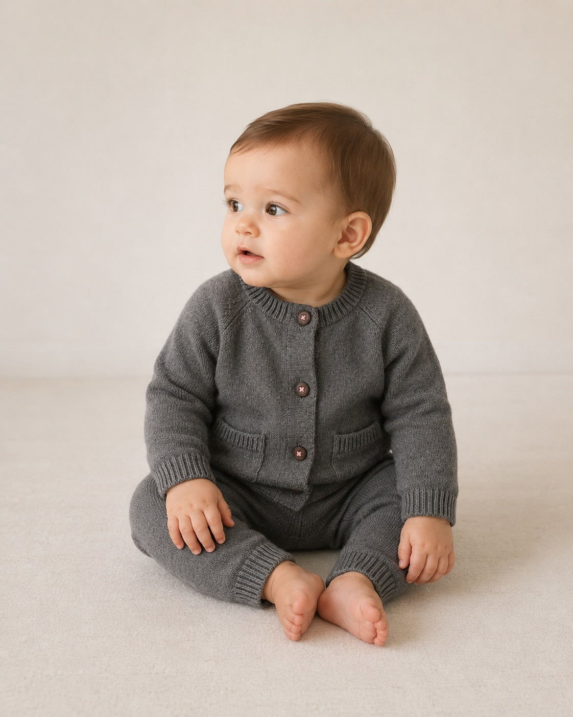Baby wearing Charcoal Milan Heather Knit Button Baby Cardigan