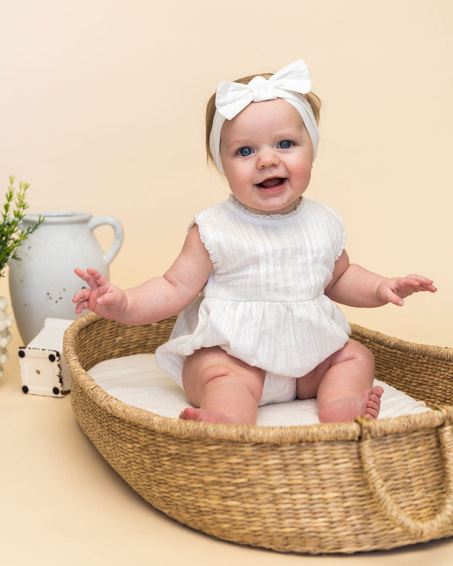 Darie Striped Dobby White Baby Romper + Headband (Organic) Model Sitting