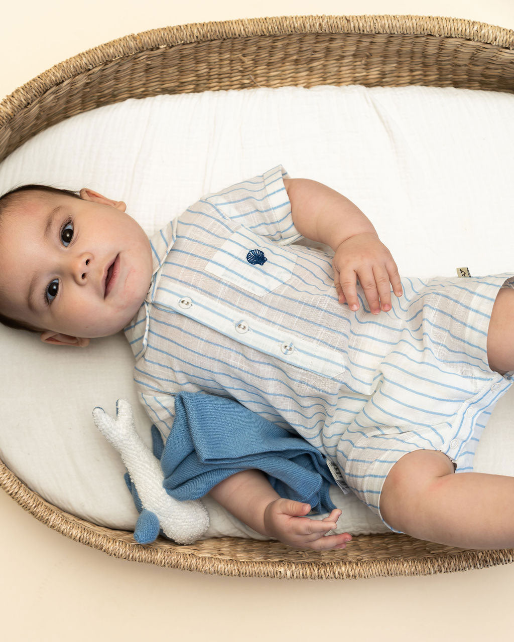 Blue Whale - Organic Baby Lovey Security Blanket Cuddle Cloth with model wearing Aqua Romper