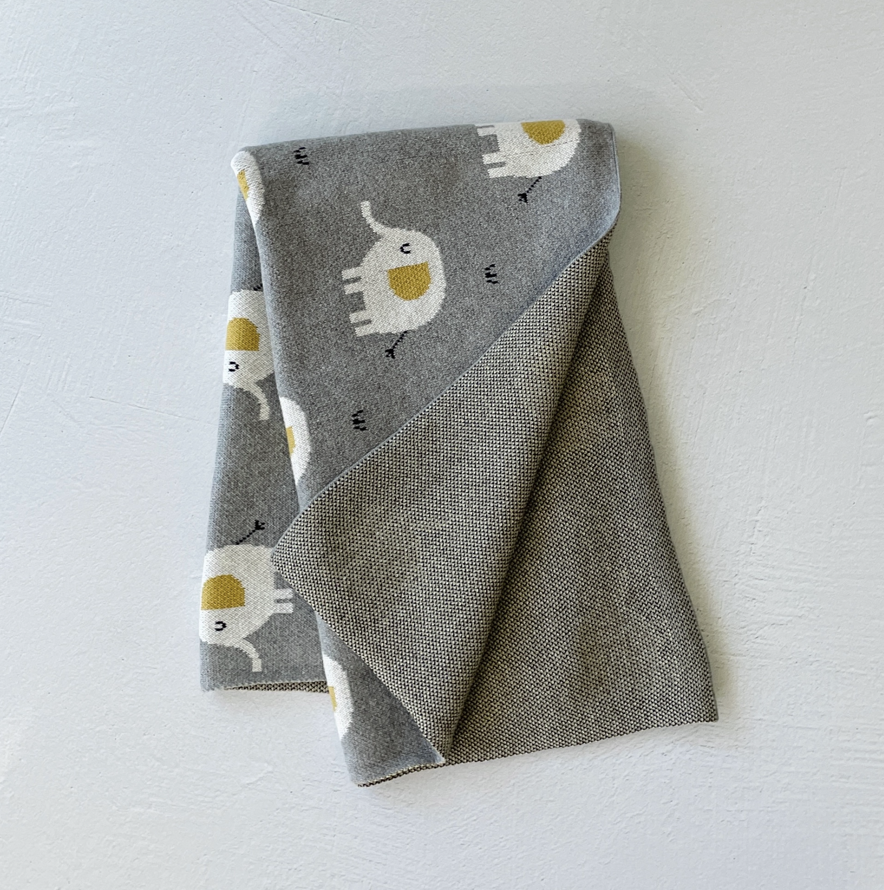 Conjunto de manta y arrullo para bebé de punto jacquard con diseño de elefante (orgánico)