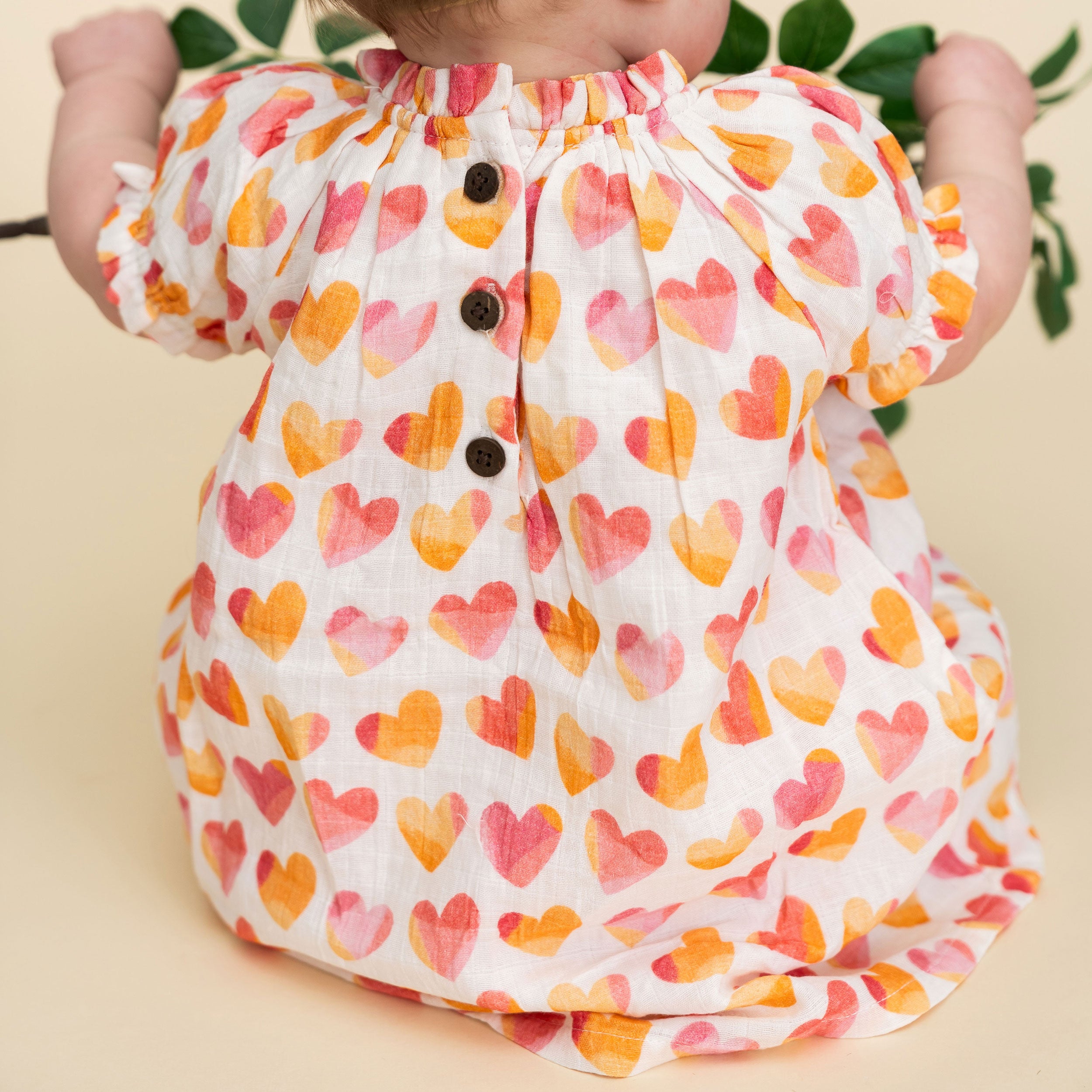 Hearts Baby Dress Model Back (Organic Muslin)