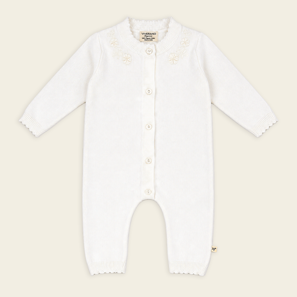 image of dove white floral embroidered knit baby jumpsuit made with organic cotton