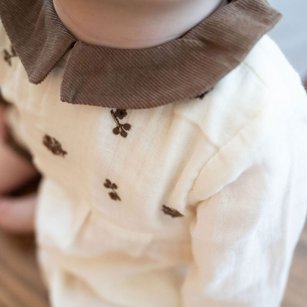 Collar detail on the Organic Embroidered Crinkle Muslin Baby Jumpsuit
